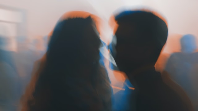 blurry image of two people about to kiss - Types Of Sexual Paraphilias