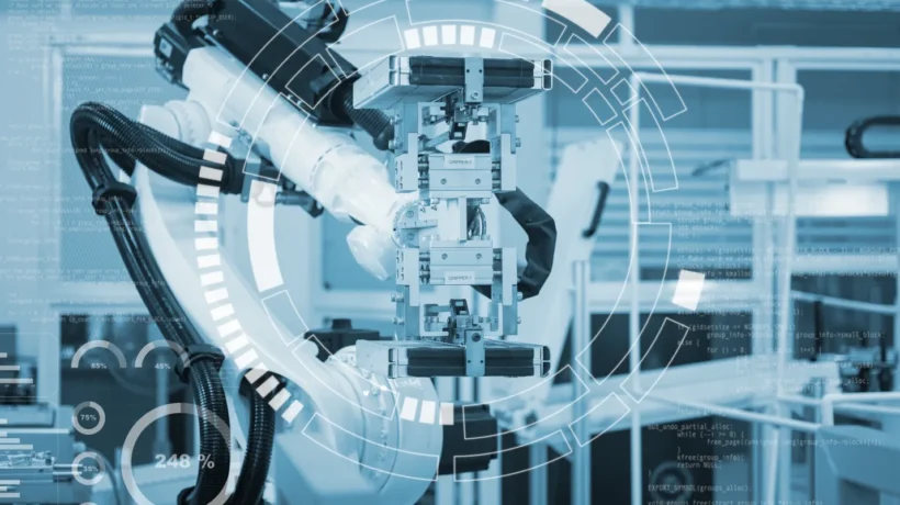 Robotic arm with a gripper on a factory line under a digital data overlay